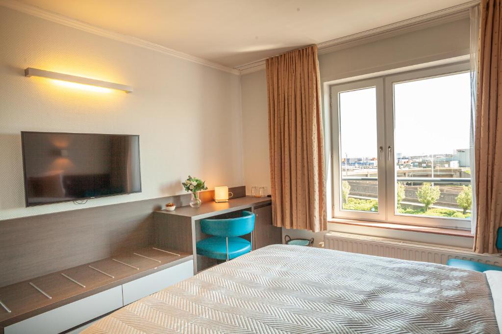 Postel nebo postele na pokoji v ubytování Hotel Monaco Zeebrugge Beach by Rikas Hotels