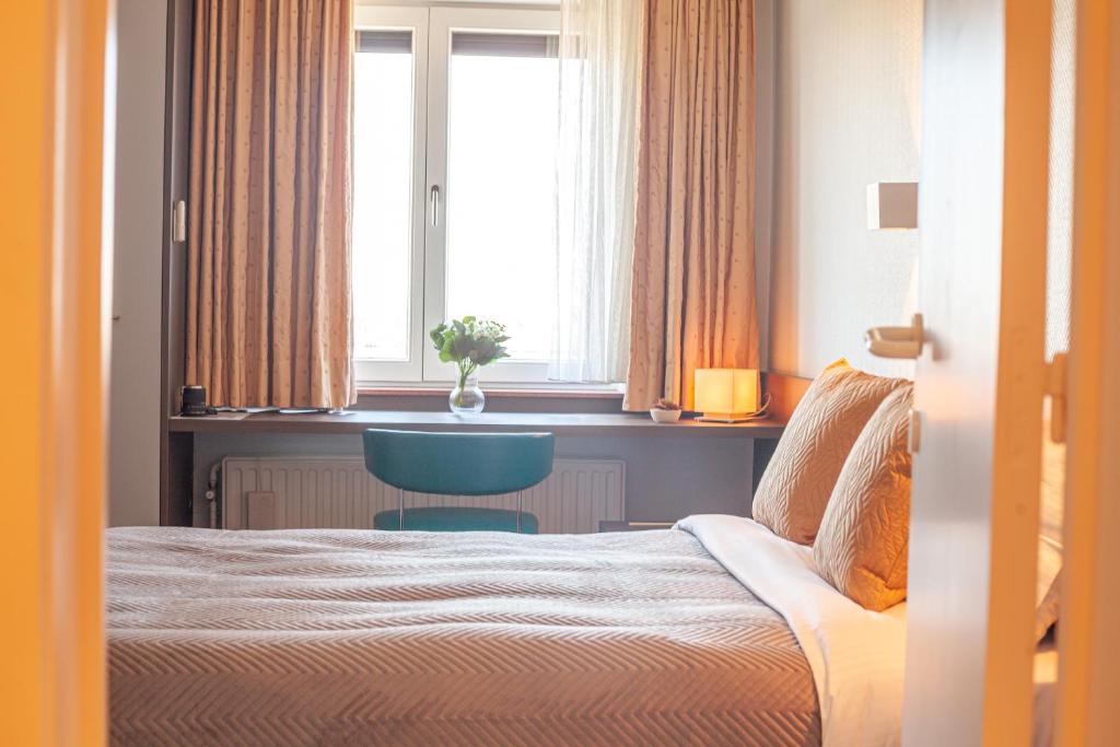 Postel nebo postele na pokoji v ubytování Hotel Monaco Zeebrugge Beach by Rikas Hotels