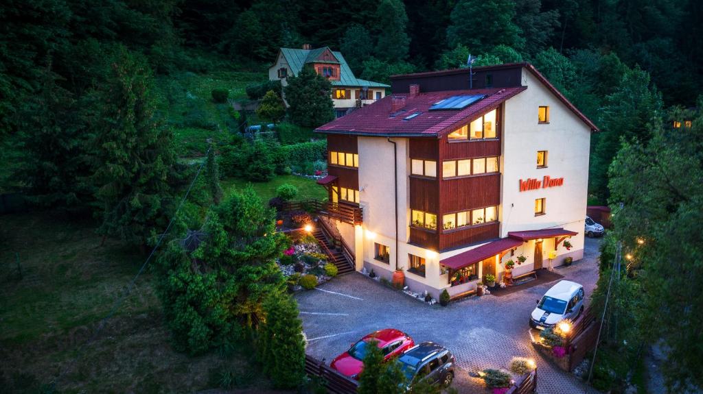 an aerial view of a house with a car parked in a parking lot at Willa Dana in Wisła