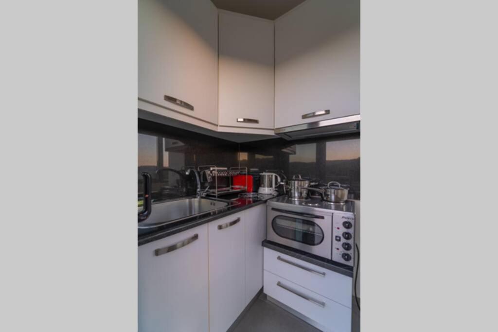 Kuchyň nebo kuchyňský kout v ubytování Αnemi apartments