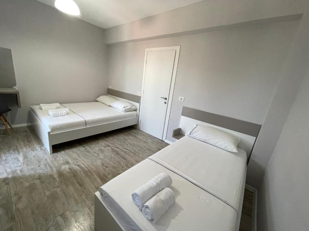 Postel nebo postele na pokoji v ubytování Hotel Cakalli