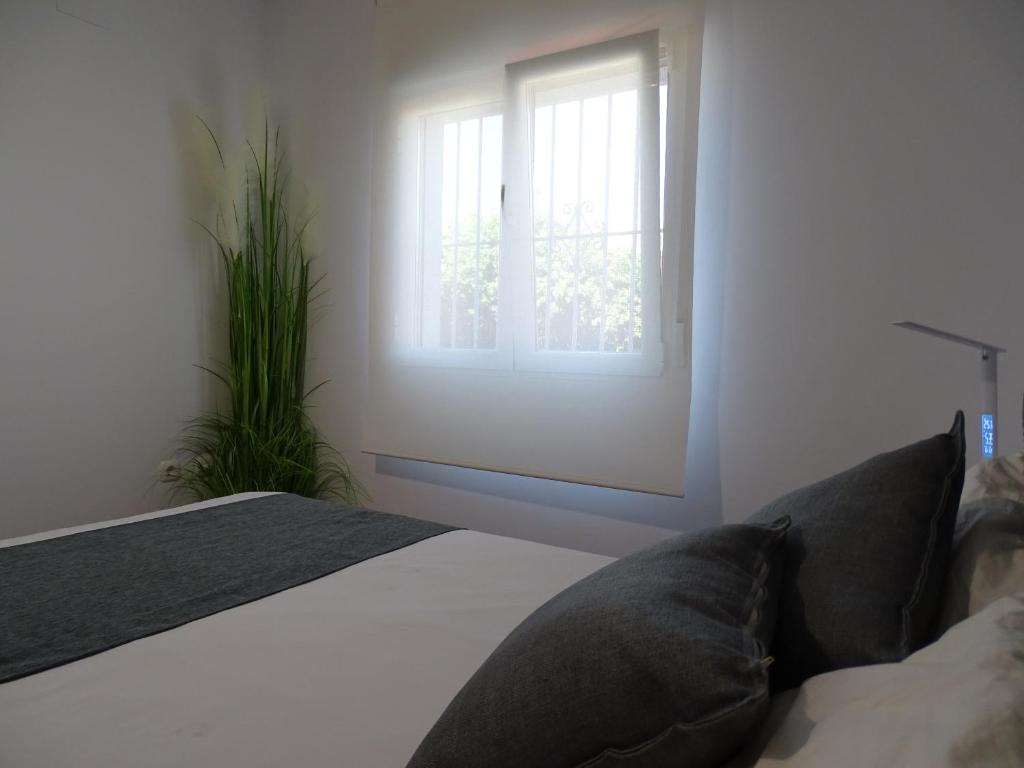 Posteľ alebo postele v izbe v ubytovaní Samadhi Home