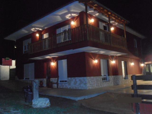 a large building with a balcony on top of it at hotel el candano in Pravia