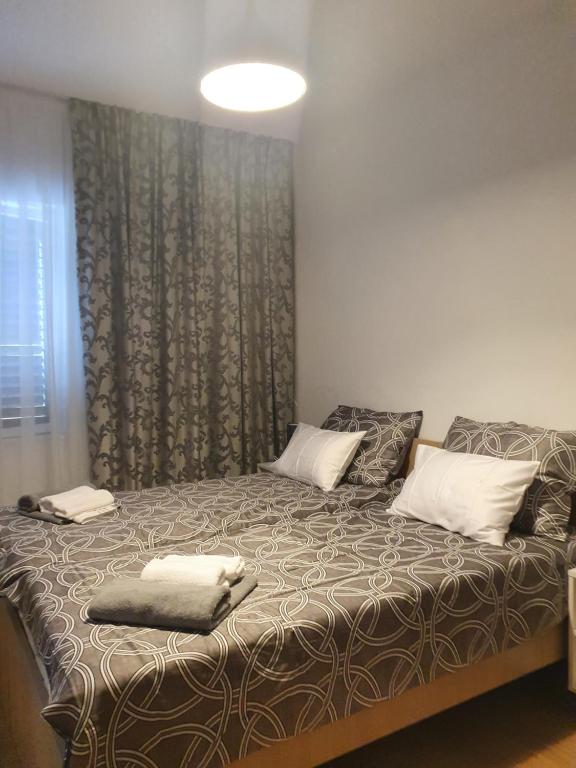 Posteľ alebo postele v izbe v ubytovaní APARTMAN VIDA 2
