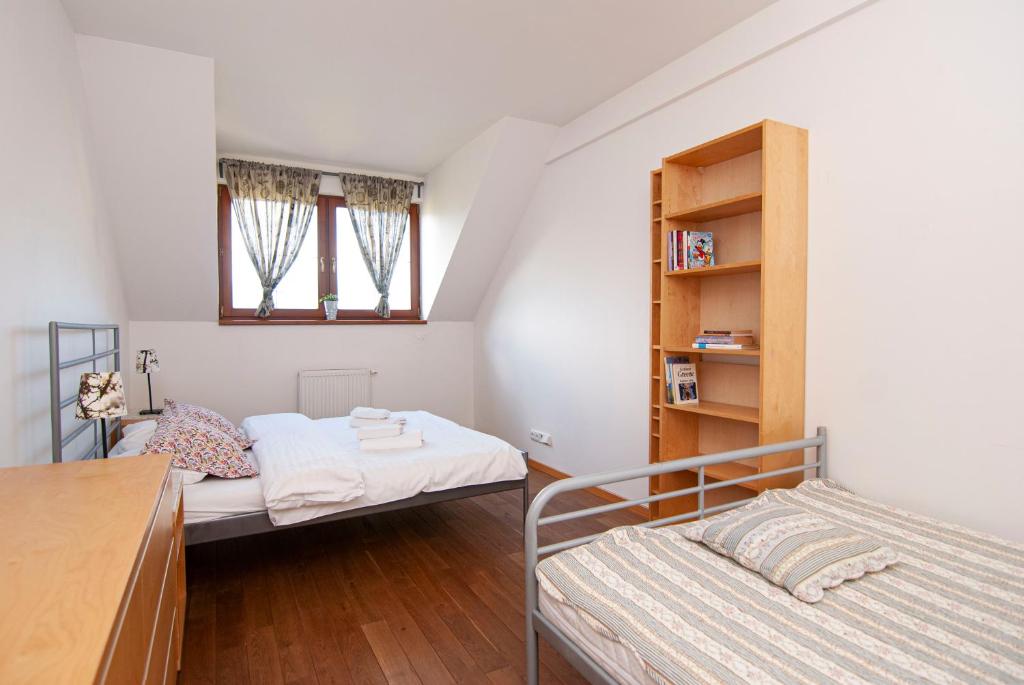 Postel nebo postele na pokoji v ubytování Apartmany Sileas