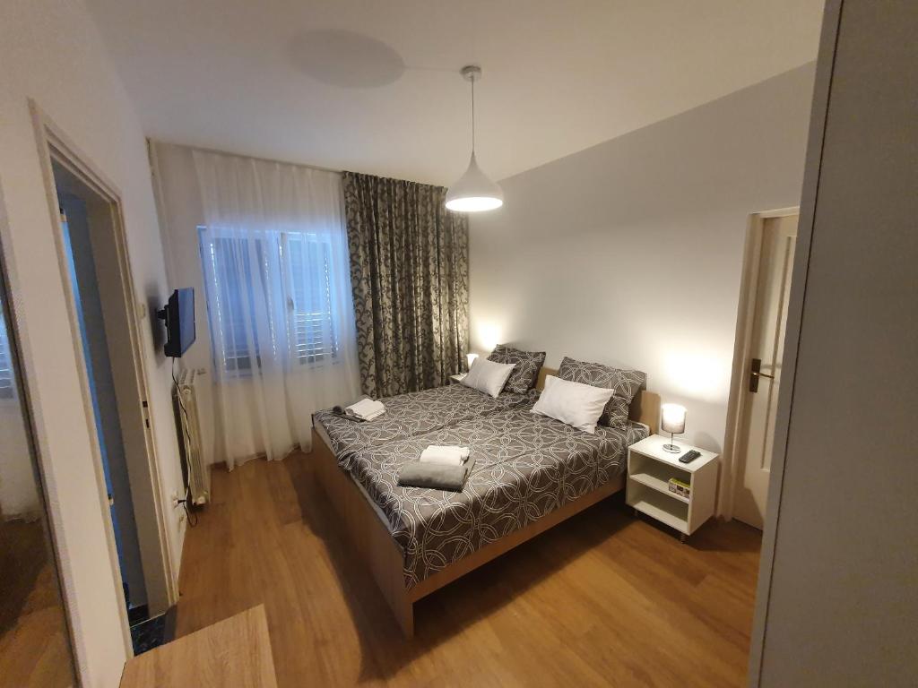Posteľ alebo postele v izbe v ubytovaní APARTMAN VIDA 2