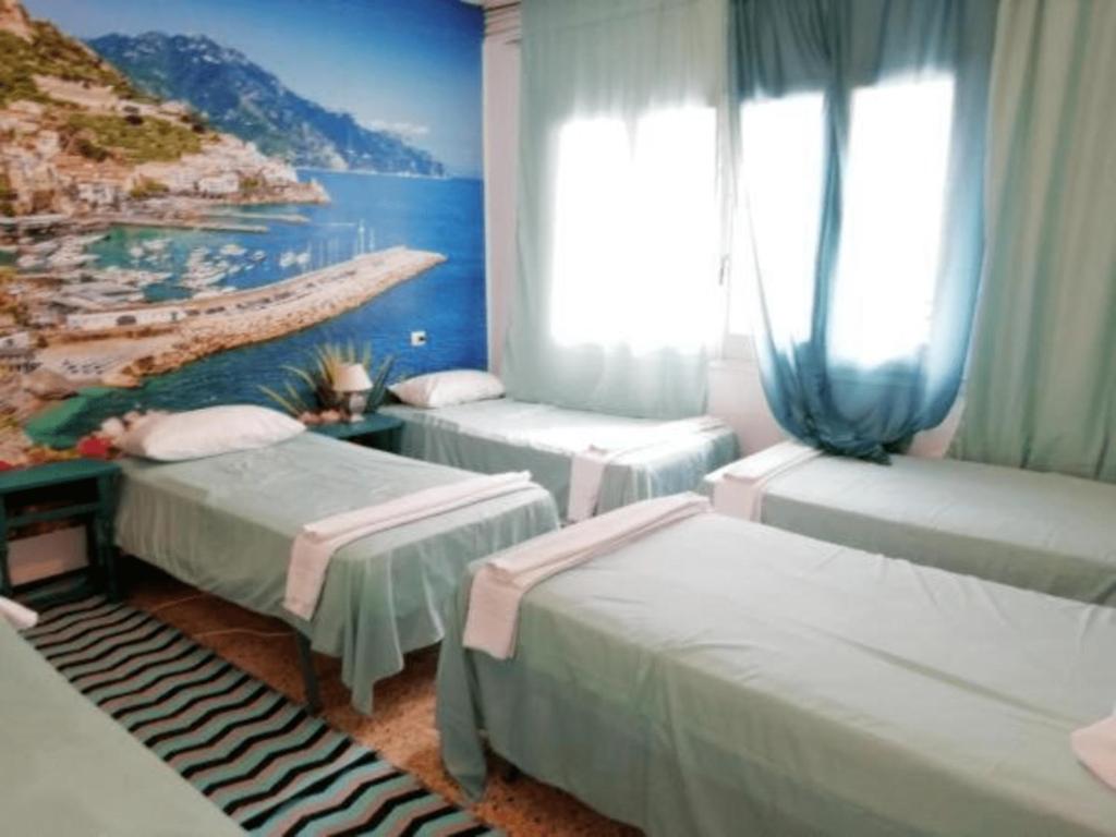 Ένα ή περισσότερα κρεβάτια σε δωμάτιο στο Camino de Santiago Guesthouse