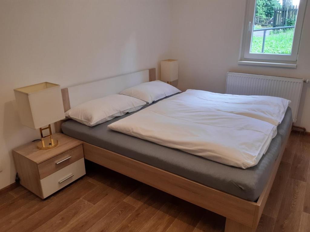 Postel nebo postele na pokoji v ubytování Pension Lesná