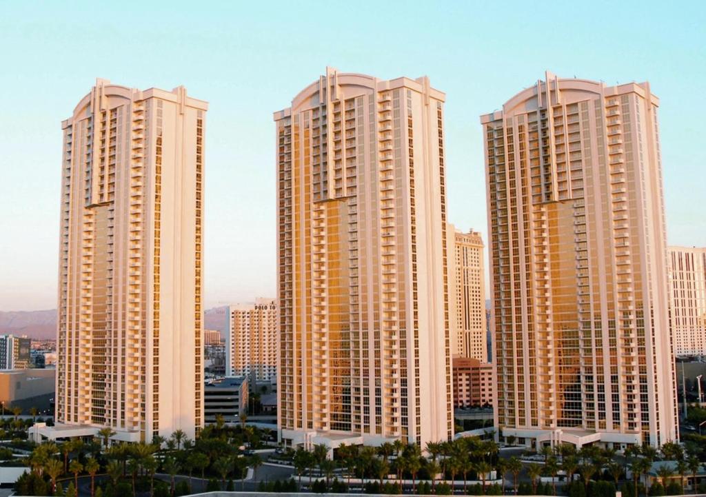 a group of tall buildings in a city at Jet Luxury at The Signature Condo Hotel in Las Vegas