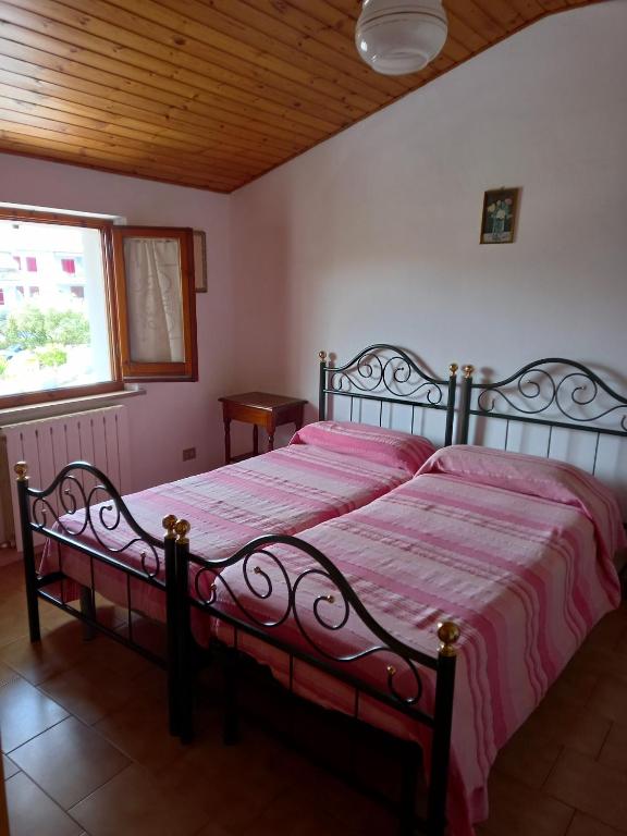 Postel nebo postele na pokoji v ubytování B&B Isabella