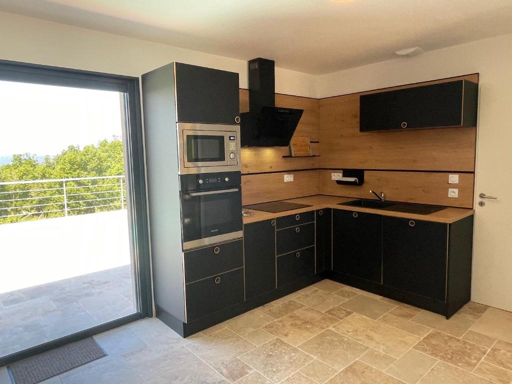 Cuisine ou kitchenette dans l'établissement Gîte du point de vue