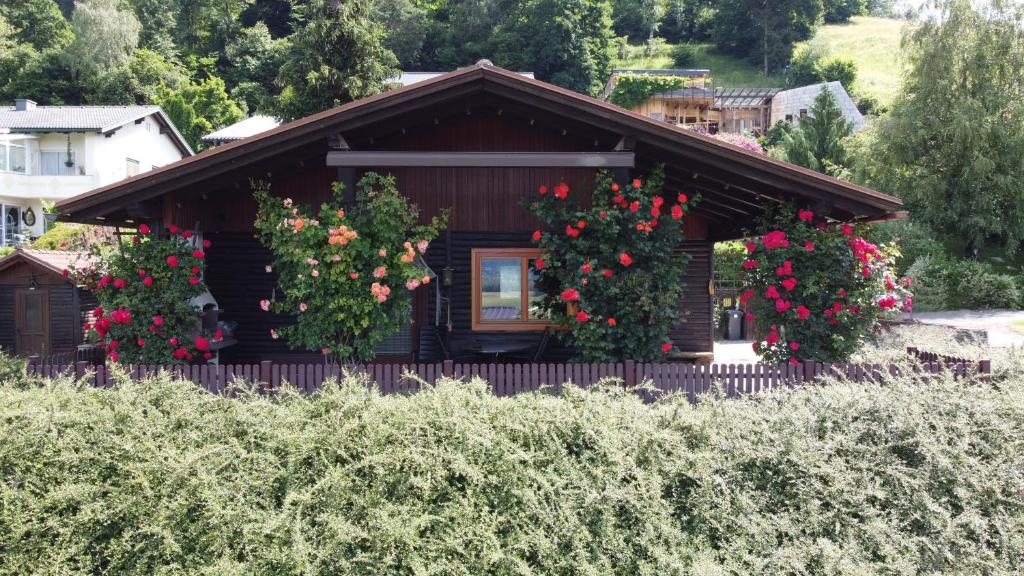 a house with flowers on the front of it at Landhaus Pepo in Feldkirchen in Kärnten