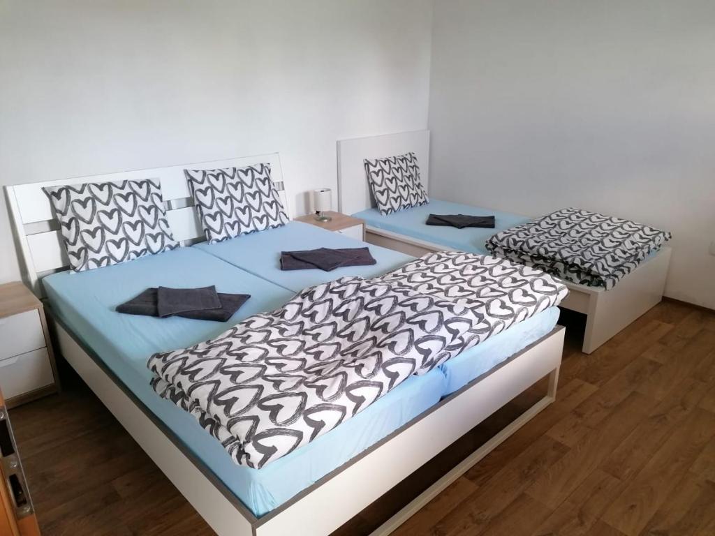 Postel nebo postele na pokoji v ubytování Penzion u Formana