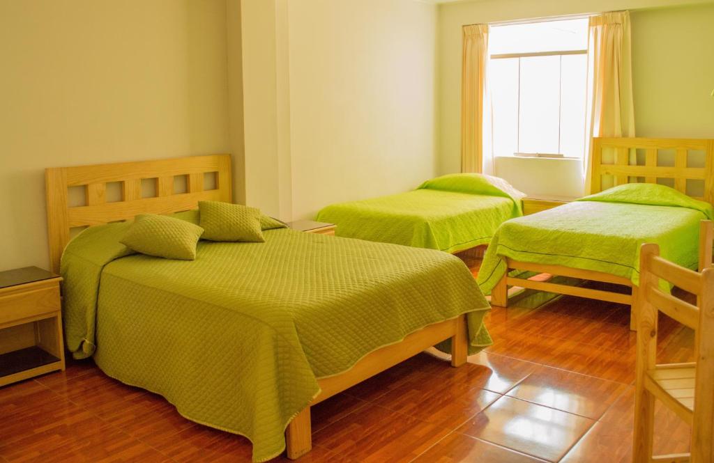 Postel nebo postele na pokoji v ubytování Takora Inn