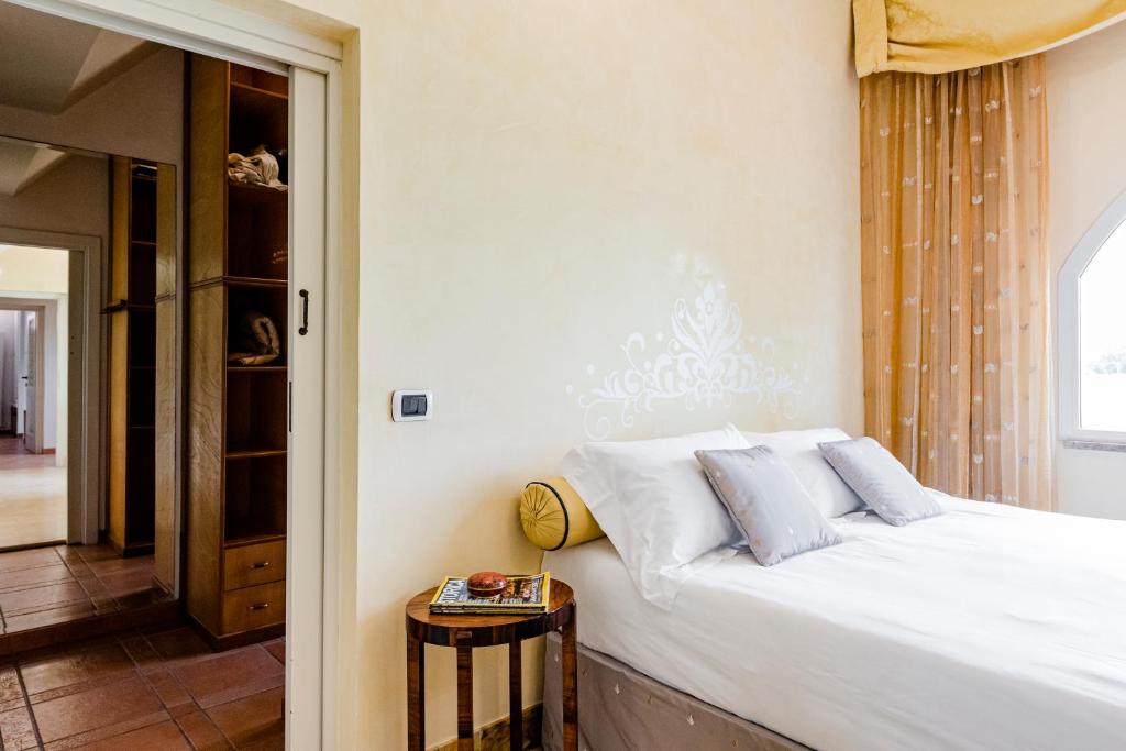 Postel nebo postele na pokoji v ubytování Villa Simonetta