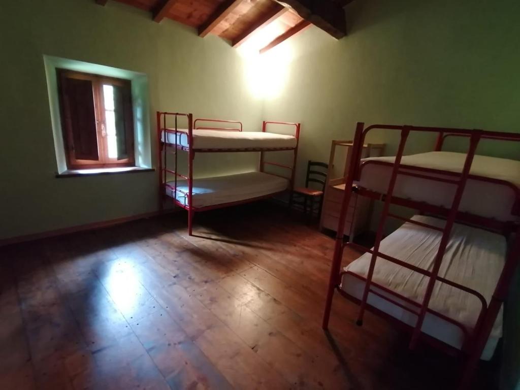 Łóżko lub łóżka w pokoju w obiekcie Parco Colle Fobia