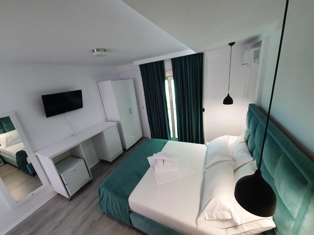 Postel nebo postele na pokoji v ubytování Hotel Aloha