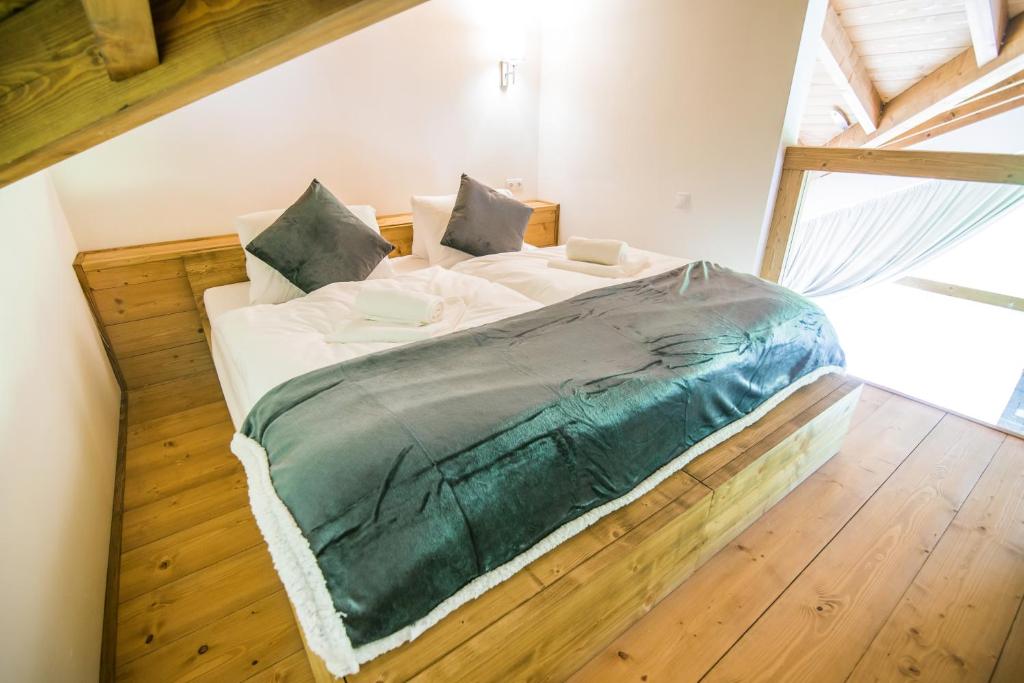 Posteľ alebo postele v izbe v ubytovaní Apartmány Tatry Žiarce
