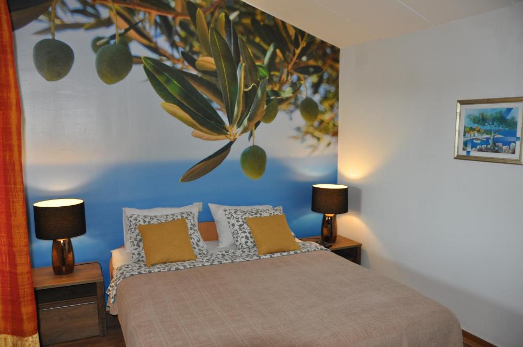 Ένα ή περισσότερα κρεβάτια σε δωμάτιο στο Olive Tree Apartment