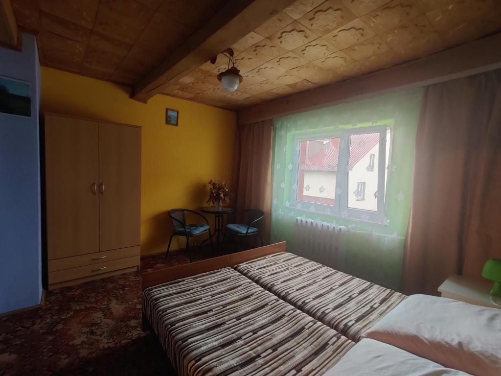 Postel nebo postele na pokoji v ubytování Przy Winogronie