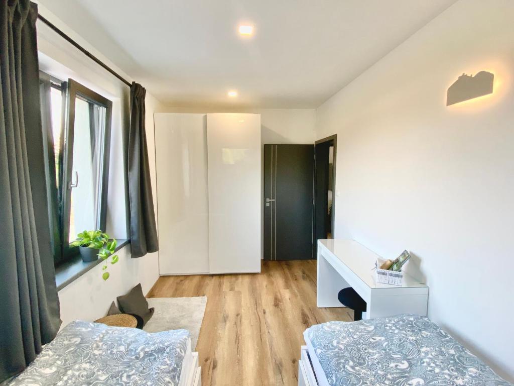 Postel nebo postele na pokoji v ubytování Apartmány DOME