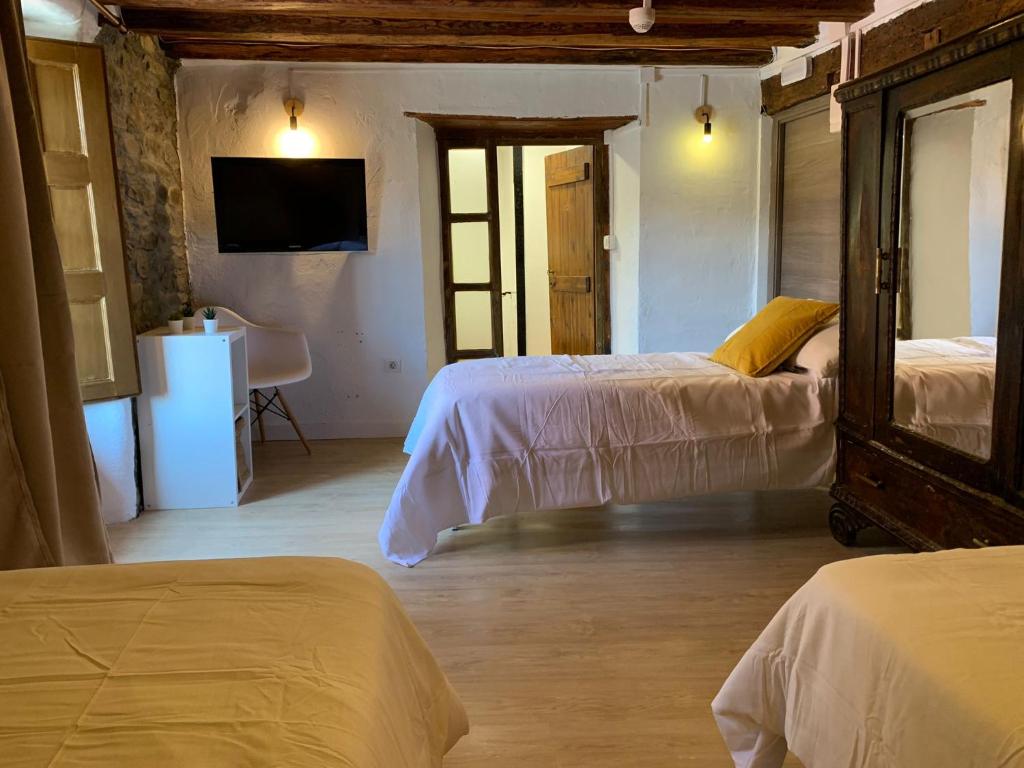 Postel nebo postele na pokoji v ubytování Maison del Arc