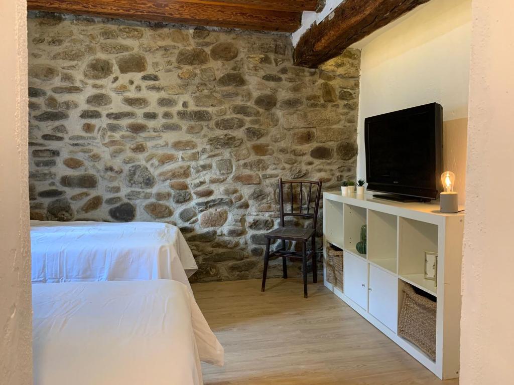 TV a/nebo společenská místnost v ubytování Maison del Arc
