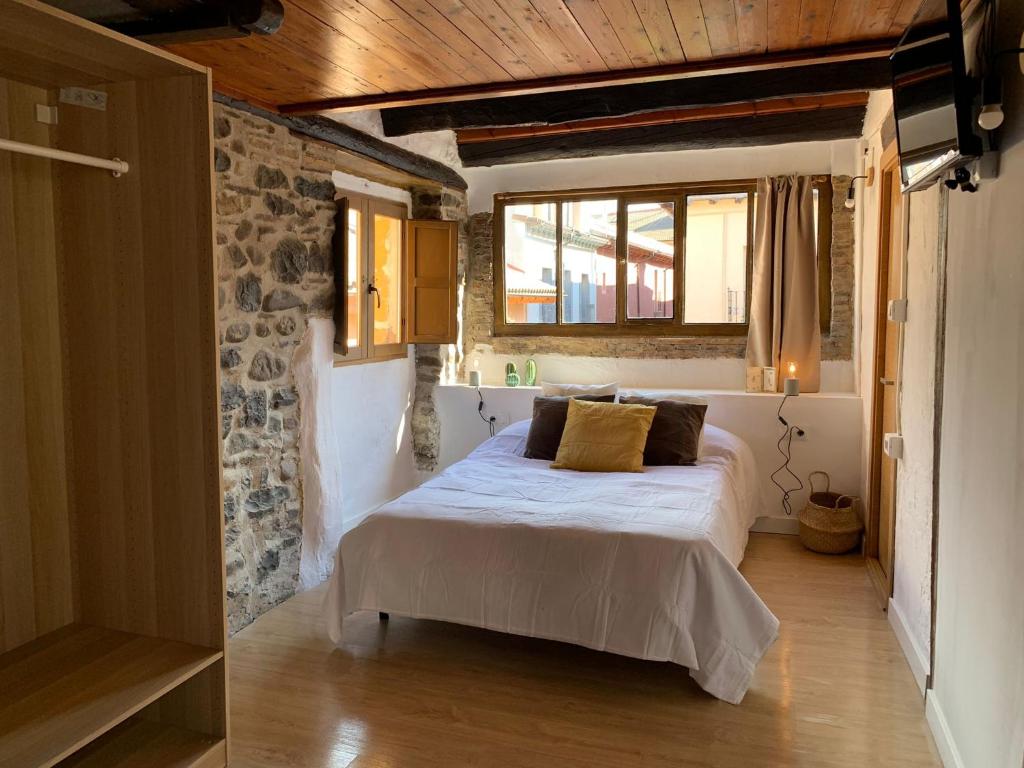 Postel nebo postele na pokoji v ubytování Maison del Arc