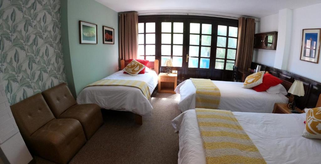 Postel nebo postele na pokoji v ubytování Hotel Churup