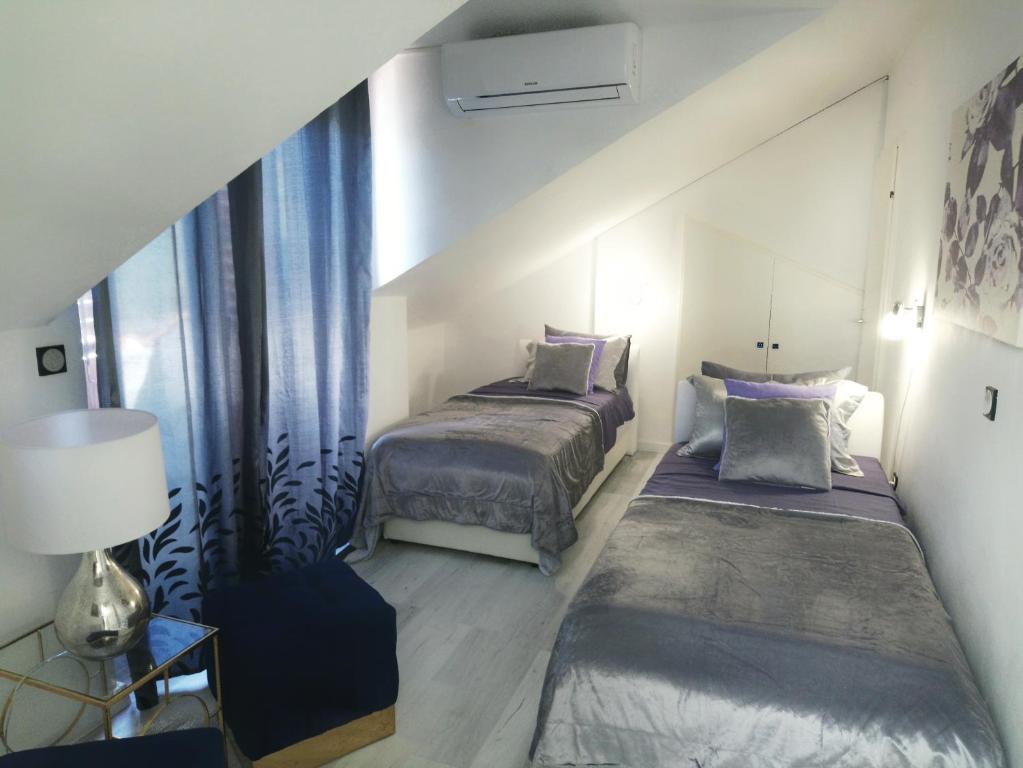 Posteľ alebo postele v izbe v ubytovaní Vacation Home Vidučić