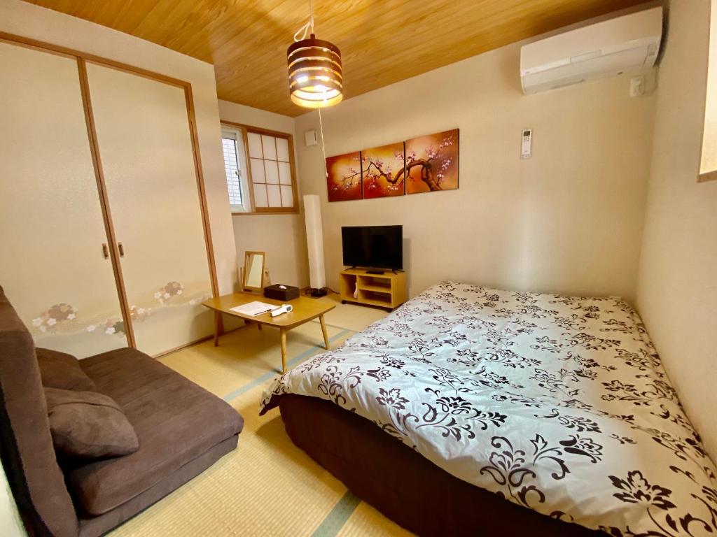 Postel nebo postele na pokoji v ubytování Hotel EL Shinjuku 6