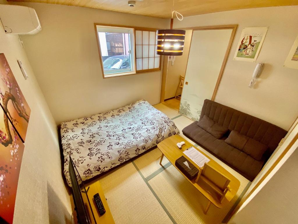 Postel nebo postele na pokoji v ubytování Hotel EL Shinjuku 6