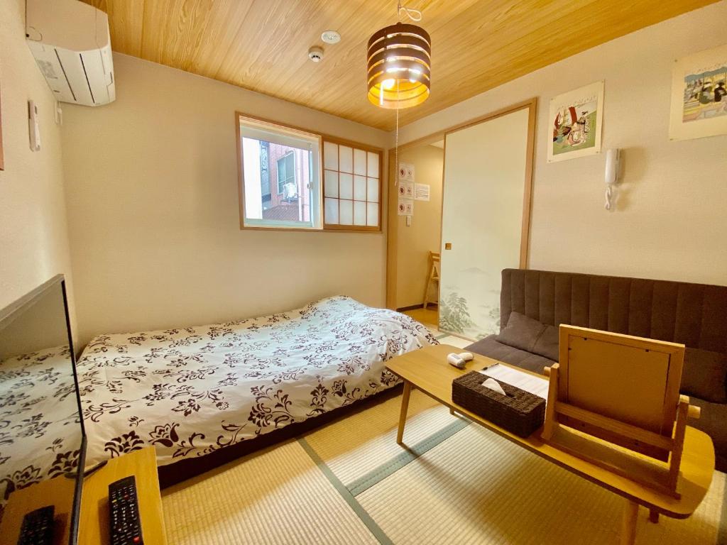 Postel nebo postele na pokoji v ubytování Hotel EL Shinjuku 6