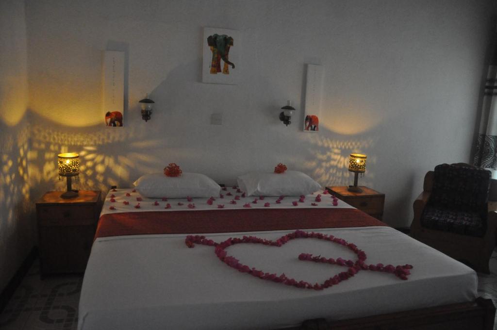 Postel nebo postele na pokoji v ubytování Hotel Thai Lanka