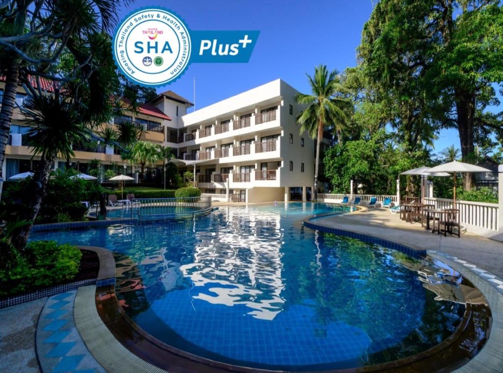 a swimming pool in front of the hotel at Patong Lodge Hotel - SHA Extra Plus in Patong Beach