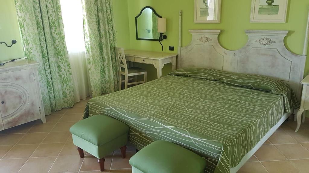 Postel nebo postele na pokoji v ubytování iGV Club Vacanze Le Castella