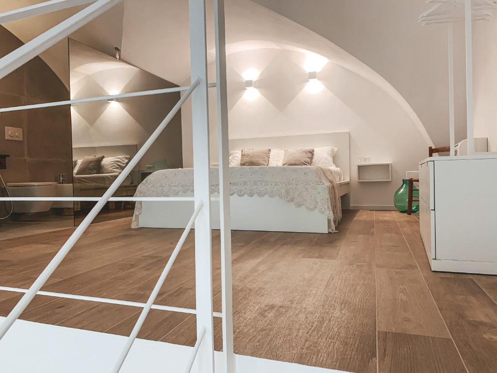 Łóżko lub łóżka w pokoju w obiekcie INDE Á LA TERRE, GUEST HOUSE Locazione Turistica