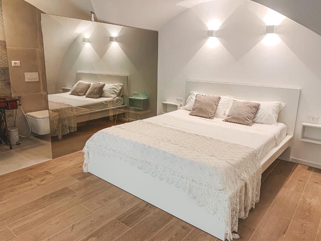Łóżko lub łóżka w pokoju w obiekcie INDE Á LA TERRE, GUEST HOUSE Locazione Turistica