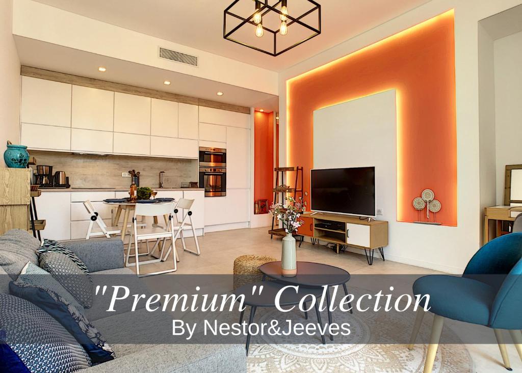 a living room with an orange and white kitchen at Nestor&Jeeves - ALBERT 1ER DESIGN - Hyper center - Very close sea and pedestrian zone in Nice