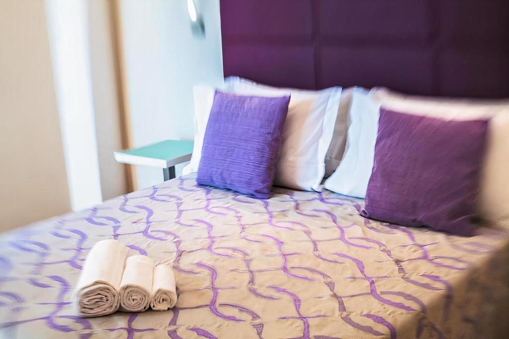 Postel nebo postele na pokoji v ubytování Hotel Royal-Spiaggia