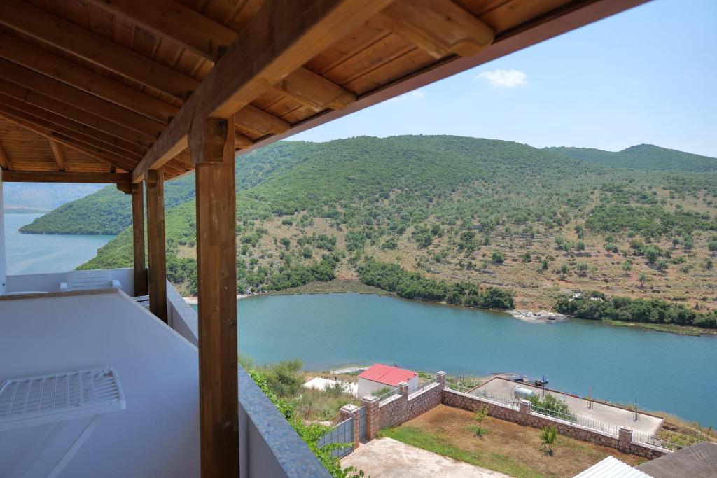 a view of a river from the balcony of a house at Pellumb Apartments in Ksamil