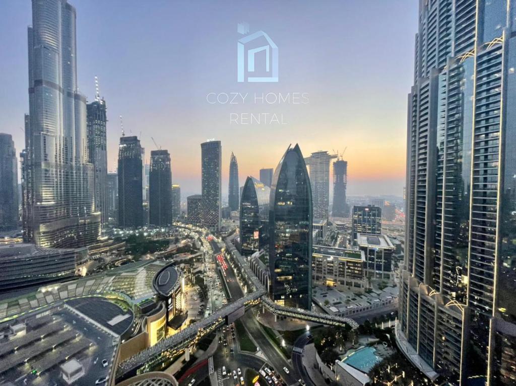 a view of a city with many tall buildings at The Address Dubai Mall Residence -Burj Khalifa View 1 in Dubai