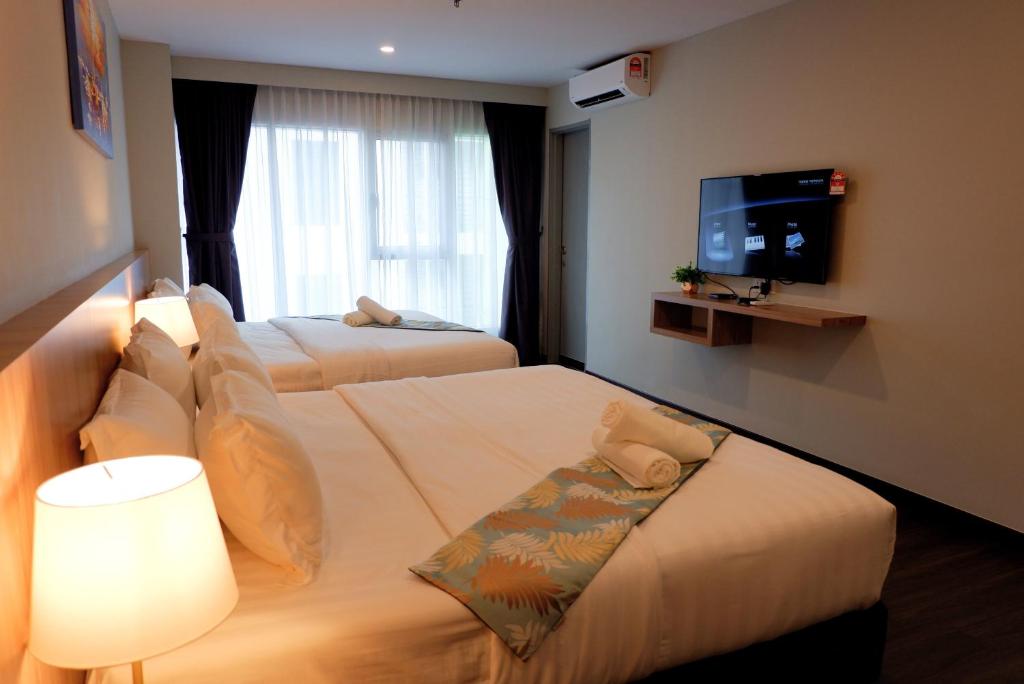 Postel nebo postele na pokoji v ubytování FLYPOD Hotel