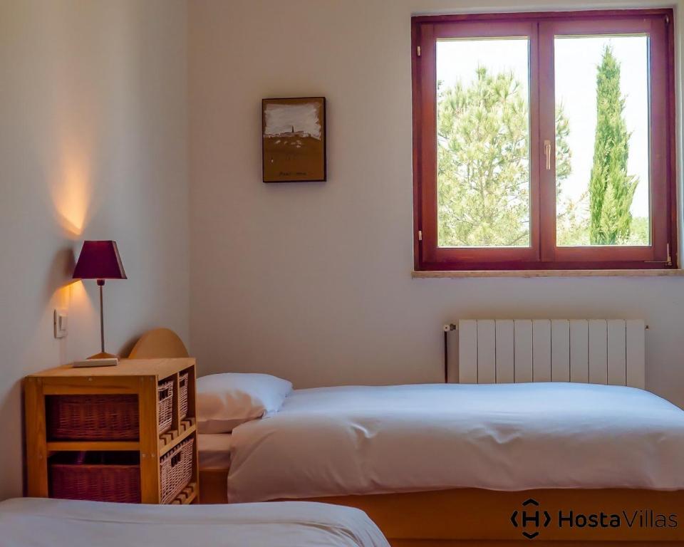 Łóżko lub łóżka w pokoju w obiekcie Villa Cypress by Istrian Country Houses