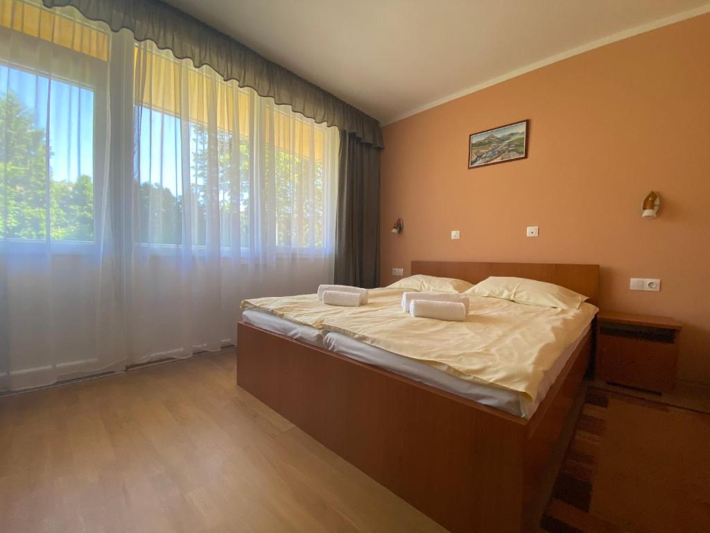Posteľ alebo postele v izbe v ubytovaní Arkánum Hotel