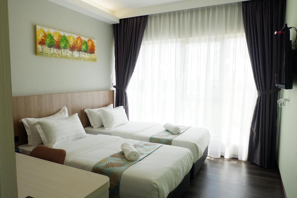 Postel nebo postele na pokoji v ubytování FLYPOD Hotel