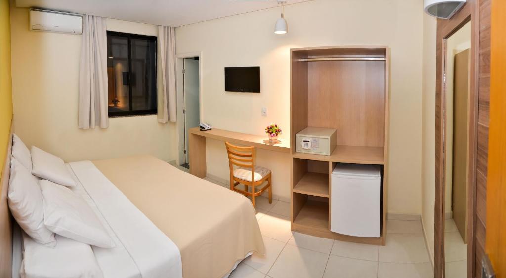 Postel nebo postele na pokoji v ubytování Hit Hotel