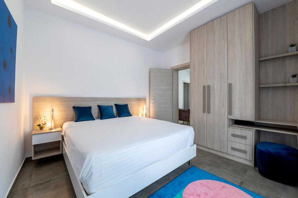 Postel nebo postele na pokoji v ubytování M Mansion