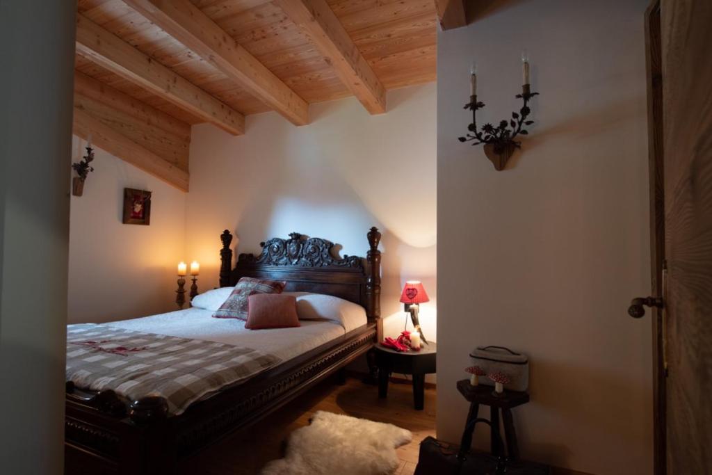 Postel nebo postele na pokoji v ubytování Chalet degli Abeti by AMA Val di Fassa