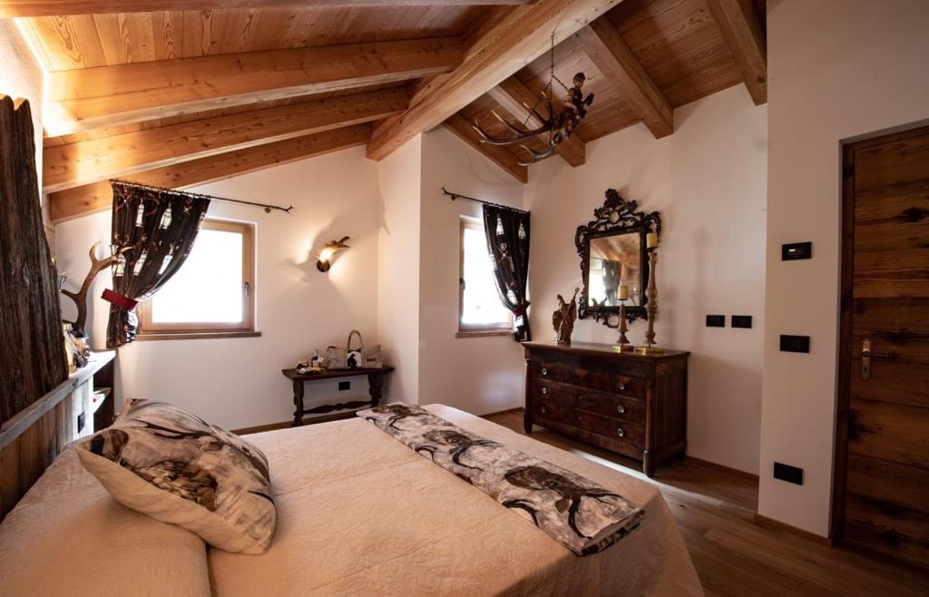 Postel nebo postele na pokoji v ubytování Chalet degli Abeti by AMA Val di Fassa